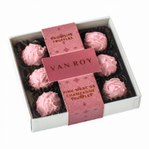 Pink Marc de Champagne truffles in 9 choc grey base with cello lid